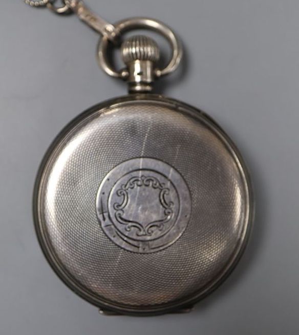 A 1920s silver open face Record keyless lever pocket watch, with a white metal albert, case diameter 48mm.